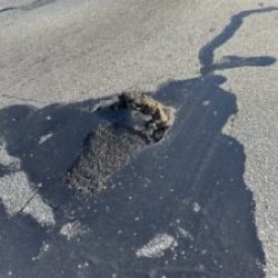 asphalt showing what pavement that might need pothole patching looks like