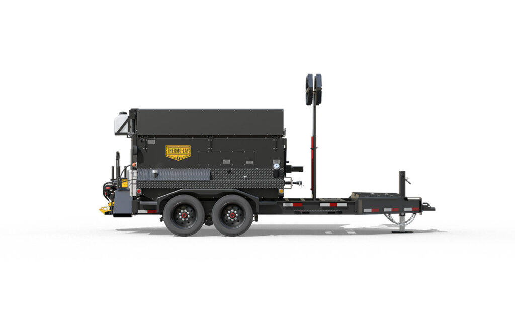 Side view of Thermo-Lay asphalt patching trailer.