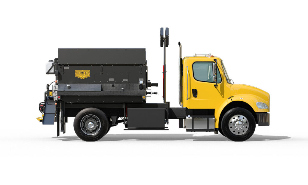 Side view of Thermo-Lay asphalt patching truck.